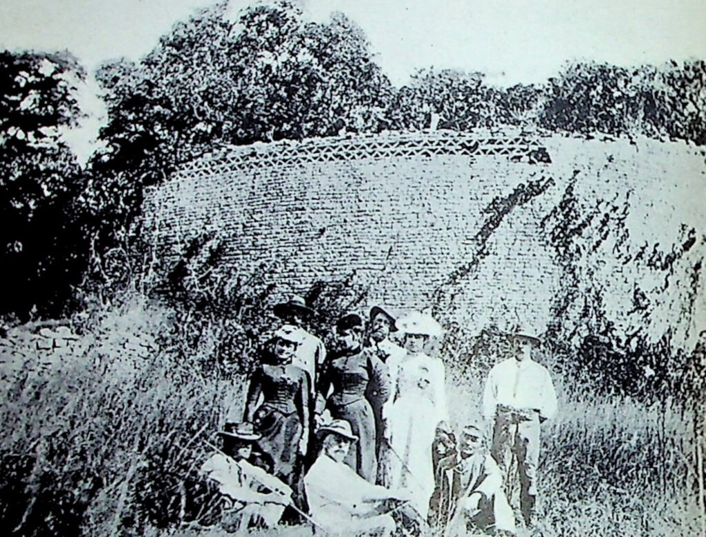 A photograph of people in front of ruins in Zimbabwe