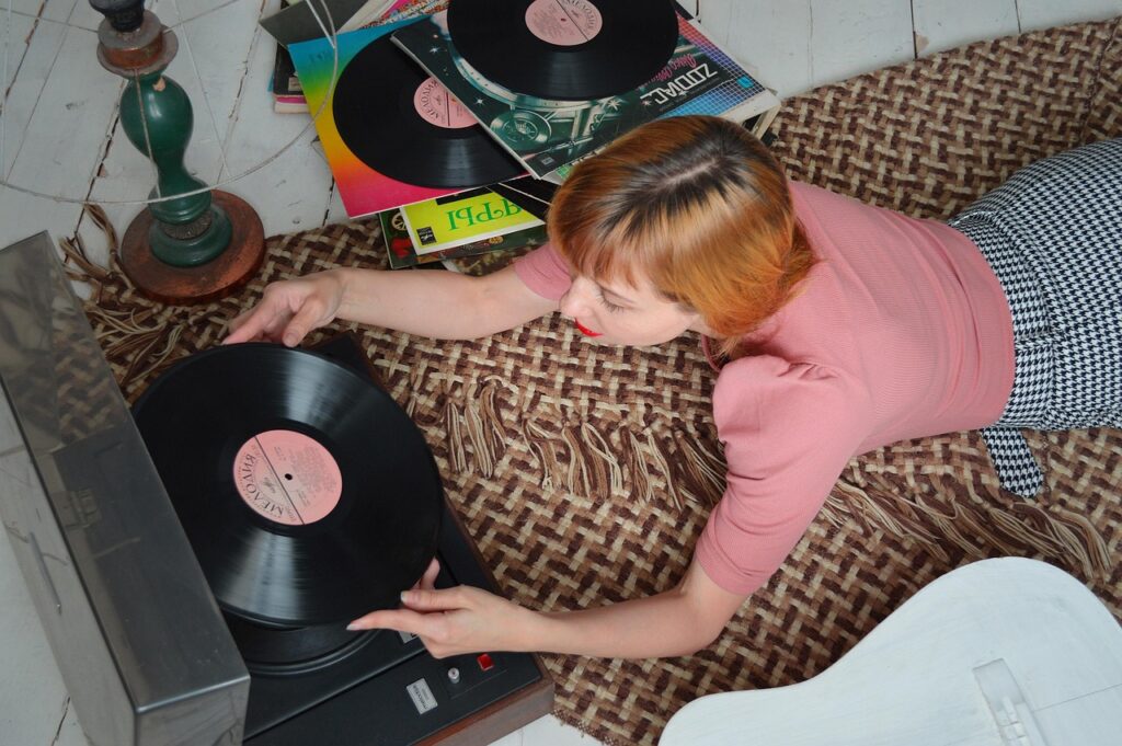 A woman listening to a record