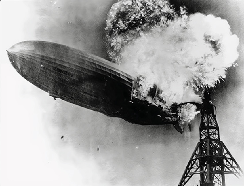 The Hindenburg explodes.
